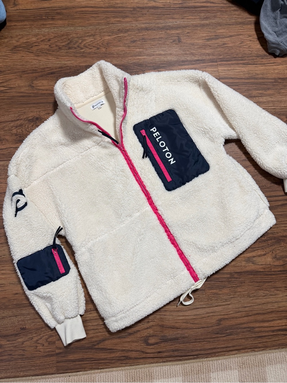 Peloton women’s Cream Sherpa Jacket with Navy Pockets